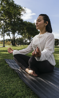 vertical-shot-hispanic-female-doing-yoga-park 1